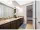 Double vanity bathroom with granite countertop and view of bedroom at 250 Pendant Ct, Kissimmee, FL 34747
