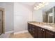 Bathroom with double vanity and large mirror at 250 Pendant Ct, Kissimmee, FL 34747