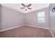Simple bedroom with neutral walls and carpeted floor at 250 Pendant Ct, Kissimmee, FL 34747