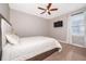 Relaxing bedroom with a ceiling fan, large bed, and neutral color scheme at 250 Pendant Ct, Kissimmee, FL 34747