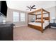 Main bedroom with a canopy bed and ceiling fan at 250 Pendant Ct, Kissimmee, FL 34747