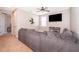 Spacious bonus room with sectional sofa and large TV at 250 Pendant Ct, Kissimmee, FL 34747