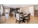 Dining room with dark wood table and chairs, near kitchen at 250 Pendant Ct, Kissimmee, FL 34747