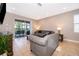 Open living area with sliding glass doors leading to the pool area at 250 Pendant Ct, Kissimmee, FL 34747