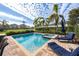 Relaxing pool and spa with lounge chairs at 250 Pendant Ct, Kissimmee, FL 34747