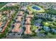 Aerial view of community with resort-style amenities, including pool and tennis courts at 2774 Almaton Loop # 305, Kissimmee, FL 34747