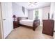 Comfortable bedroom with a sleigh bed and wood furniture at 2774 Almaton Loop # 305, Kissimmee, FL 34747