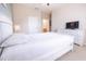 Guest bedroom with a queen bed and TV at 2774 Almaton Loop # 305, Kissimmee, FL 34747