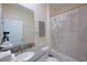 A well-lit bathroom with a shower-tub combination and a modern vanity with grey countertop at 2797 Bookmark Dr, Kissimmee, FL 34746