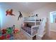 Themed bedroom with bunk beds, Marvel decals, and neutral carpeting throughout at 2797 Bookmark Dr, Kissimmee, FL 34746