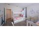 bedroom with a white bunk bed, princess-themed decor, carpet flooring, and natural light at 2797 Bookmark Dr, Kissimmee, FL 34746