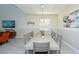 Bright dining area features a large table, stylish decor, and modern lighting at 2797 Bookmark Dr, Kissimmee, FL 34746