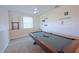 Spacious game room featuring a pool table, ceiling fan, and decorative wall art at 2797 Bookmark Dr, Kissimmee, FL 34746