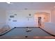 A large game room featuring a pool table, arched entry, and stairs to another level at 2797 Bookmark Dr, Kissimmee, FL 34746
