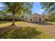 Brick house with a front yard and driveway at 2880 Old Canoe Creek Rd, St Cloud, FL 34772