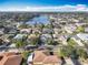 Community overview featuring lake and numerous homes at 301 Anastasia Dr, Kissimmee, FL 34759
