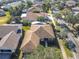 Aerial view of single-Gathering home with surrounding neighborhood at 301 Anastasia Dr, Kissimmee, FL 34759