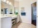 Bathroom with double vanity and a large mirror at 301 Anastasia Dr, Kissimmee, FL 34759