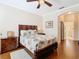 Bright bedroom with wood floors, a comfortable bed, and plenty of storage at 301 Anastasia Dr, Kissimmee, FL 34759