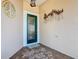 Front entry with green door and decorative accents at 301 Anastasia Dr, Kissimmee, FL 34759