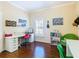 Spacious home office with wood flooring, large window, and built-in workspace at 301 Anastasia Dr, Kissimmee, FL 34759
