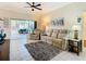 Living room with sliding doors leading to patio at 301 Anastasia Dr, Kissimmee, FL 34759