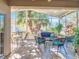 Spacious screened porch with seating area and view of lush greenery at 301 Anastasia Dr, Kissimmee, FL 34759