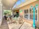 Relaxing screened porch with seating and dining area at 301 Anastasia Dr, Kissimmee, FL 34759