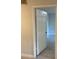 Simple hallway with neutral walls and tile floor at 3036 Parkway Blvd # 106, Kissimmee, FL 34747