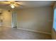 Spacious living room with tile floor and ceiling fan at 3036 Parkway Blvd # 106, Kissimmee, FL 34747