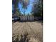 Backyard features gravel surface, two large storage sheds, and a wooden fence line at 372 La Paz Dr, Kissimmee, FL 34743