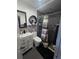 Modern bathroom features tiled walls, a shower, sleek fixtures, and stylish vanity at 372 La Paz Dr, Kissimmee, FL 34743