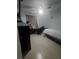Cozy bedroom with tile floors, a bed, and a sewing station at 372 La Paz Dr, Kissimmee, FL 34743