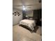 Neutral bedroom features decorative mirrors, a ceiling fan, and cozy bedding at 372 La Paz Dr, Kissimmee, FL 34743