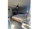 Comfortable main bedroom with ceiling fan, tile floors, and sliding door closet at 372 La Paz Dr, Kissimmee, FL 34743
