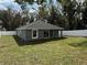 Well-maintained backyard with a newly installed white fence, perfect for outdoor activities and relaxation at 3839 Se 132Nd Pl, Belleview, FL 34420
