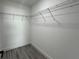 Walk-in closet with custom shelving offers ample storage space at 3839 Se 132Nd Pl, Belleview, FL 34420