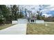 Lovely single story home with gray and white paint, two car garage, and white fence at 3839 Se 132Nd Pl, Belleview, FL 34420