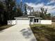 Beautiful home with a white fence, two-car garage, and well-kept lawn at 3839 Se 132Nd Pl, Belleview, FL 34420