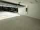 Clean and spacious two-car garage with concrete floor and automatic door opener at 3839 Se 132Nd Pl, Belleview, FL 34420