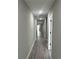 Hallway with gray walls and gray flooring at 3839 Se 132Nd Pl, Belleview, FL 34420