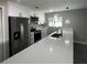 Kitchen area with quartz countertops and black faucet at 3839 Se 132Nd Pl, Belleview, FL 34420