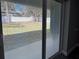 View from inside the living room looking out onto the patio and fenced backyard at 3839 Se 132Nd Pl, Belleview, FL 34420
