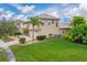 Two-story house with a large backyard and palm trees at 4010 Navigator Way, Kissimmee, FL 34746