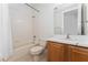 Clean bathroom with shower/tub combo and wood vanity at 4010 Navigator Way, Kissimmee, FL 34746