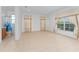 An empty bedroom space, with large windows providing natural light and an attached bathroom at 4010 Navigator Way, Kissimmee, FL 34746