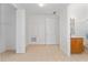 Light, empty room with closet and access to bathroom with tiled floors and white doors at 4010 Navigator Way, Kissimmee, FL 34746