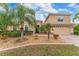 Two-story house with landscaped yard and two-car garage at 4010 Navigator Way, Kissimmee, FL 34746