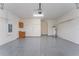 Attached garage with epoxy flooring and built-in shelving at 4010 Navigator Way, Kissimmee, FL 34746