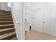 Convenient laundry room with built-in shelving and stairs at 4010 Navigator Way, Kissimmee, FL 34746
